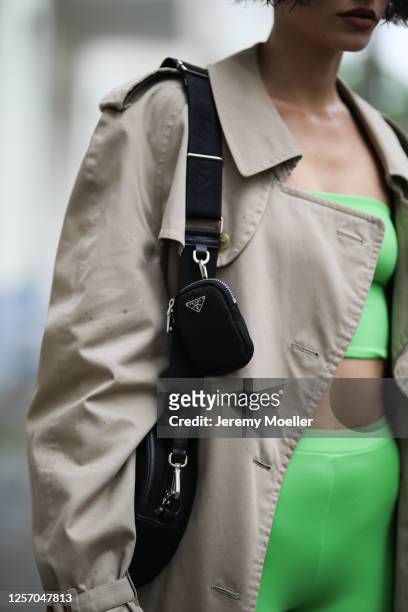 Lea Neumann wearing Burberry vintage coat, Prada bag and Bershka two piece on July 15, 2020 in Berlin, Germany.