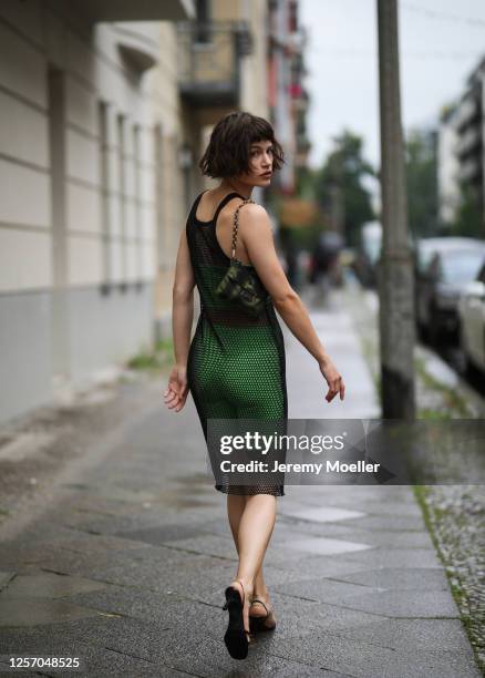 Lea Neumann wearing Bershka two pieces, Prada bag, Zalando shoes and vintage mesh top on July 15, 2020 in Berlin, Germany.