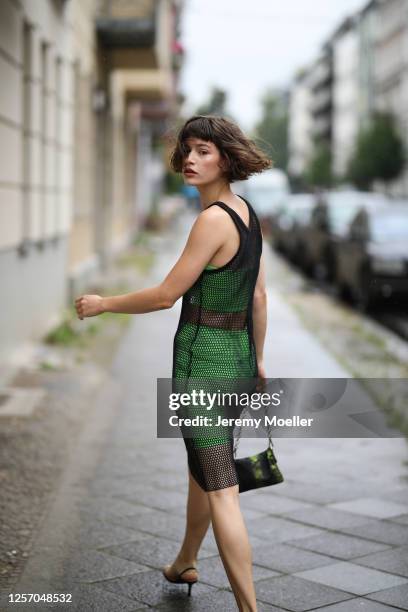 Lea Neumann wearing Bershka two pieces, Prada bag, Zalando shoes and vintage mesh top on July 15, 2020 in Berlin, Germany.