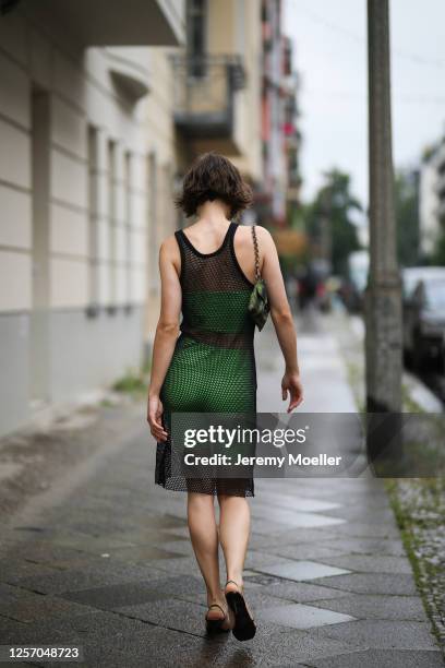 Lea Neumann wearing Bershka two pieces, Prada bag, Zalando shoes and vintage mesh top on July 15, 2020 in Berlin, Germany.