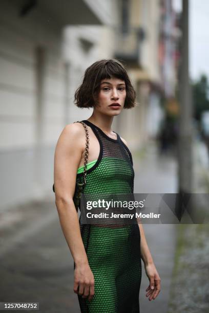 Lea Neumann wearing Bershka two pieces, Prada bag and vintage mesh top on July 15, 2020 in Berlin, Germany.