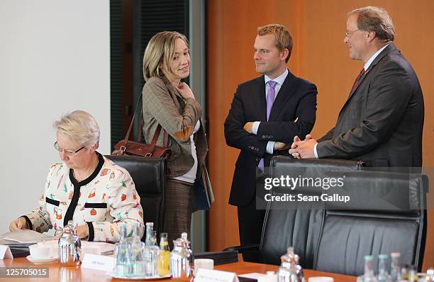 German Education Minister Annette Schavan, Family Minister Kristina Schroeder, Health Minister Daniel Bahr and Development Minister Dirk Niebel...