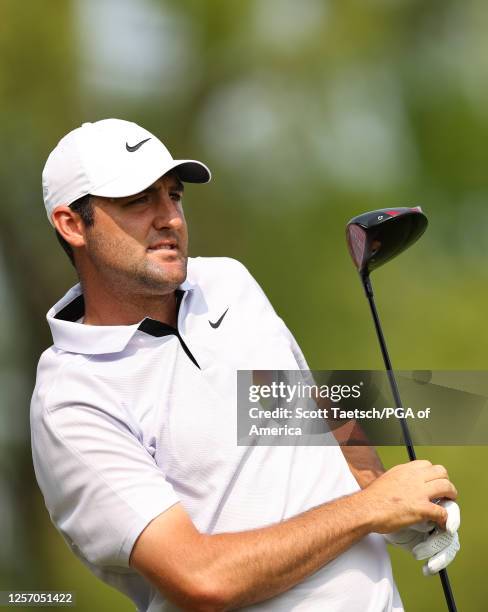 Scottie Scheffler watches his tee shot on the ninth hole during the final round of the PGA Championship at Oak Hill Country Club on Sunday, May 21,...