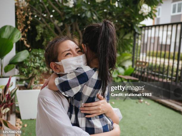 cheerful daughter running towards mother after her return from a hospital after a coronavirus, covid-19 recovery. - mother daughter hospital running stock pictures, royalty-free photos & images