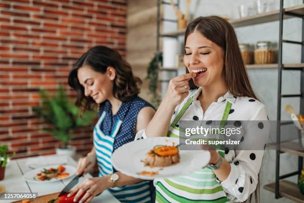 young women preparing food in the kitchen - tuna fish stock pictures, royalty-free photos & images