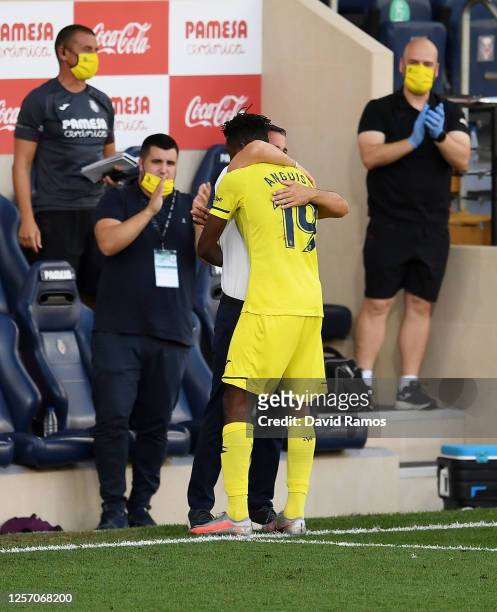 Andre-Frank Zambo Anguissa of Villarreal celebrates with Javier Calleja, Manager of Villarreal after scoring his team's first goal during the Liga...