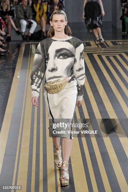 Model walks the runway during the Unique show at London Fashion Week Spring/Summer 2012 at the Topshop Venue at the Old Eurostar Terminal on...