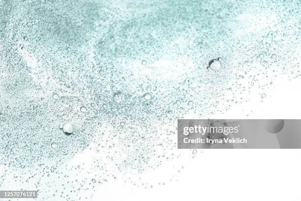 fluid hyaluronic acid, gel or serum with bubbles. - ha stock pictures, royalty-free photos & images