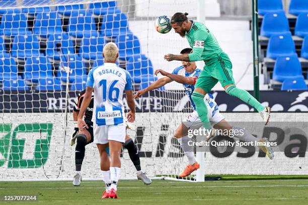 Sergio Ramos of Real Madrid CF heads the ball to score his team's first goal during the Liga match between CD Leganes and Real Madrid CF at Estadio...