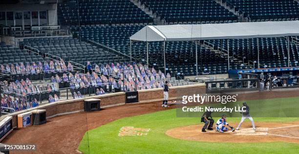 The New York Mets have cardboard cutouts of fans in the seats while playing the New York Yankees in a pre-season exhibition game at Citi Field in...