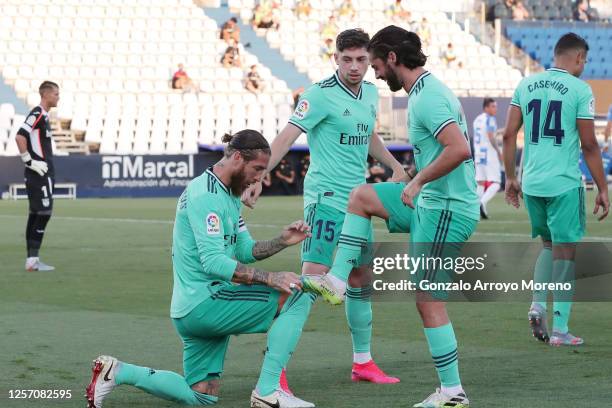 Sergio Ramos of Real Madrid celebrates his team's first goal with teammate Isco during the Liga match between CD Leganes and Real Madrid CF at...