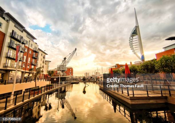 sunset at gunwharf quays in portsmouth - portsmouth england stock pictures, royalty-free photos & images