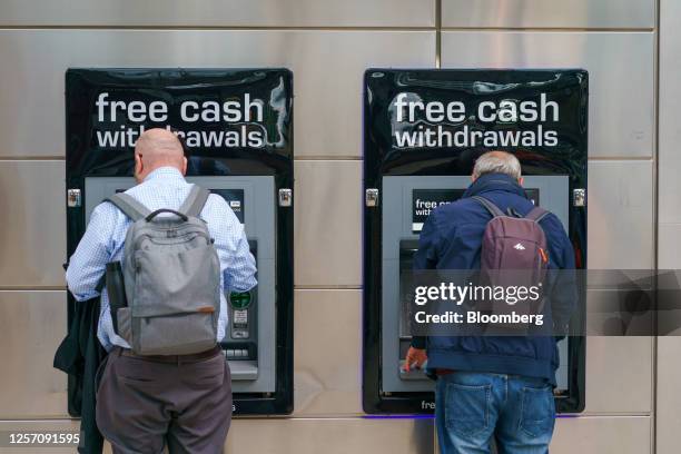 Customers use automated teller machines machines in Sheffield, UK, on Friday, May 19, 2023. The Office for National Statistics are due to release the...