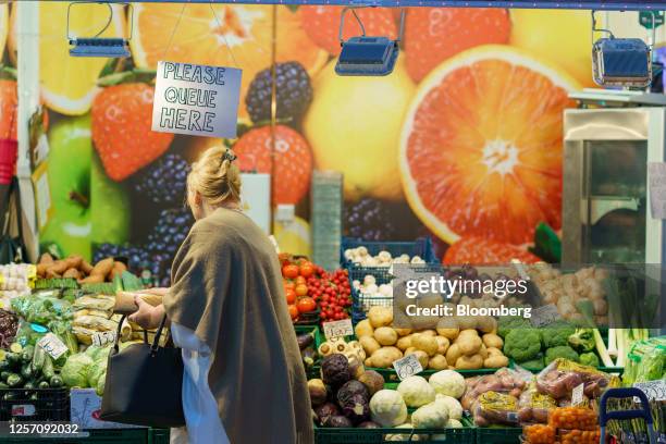 Shopper browses fruit and vegetables for sale at an indoor market in Sheffield, UK, on Friday, May 19, 2023. The Office for National Statistics are...