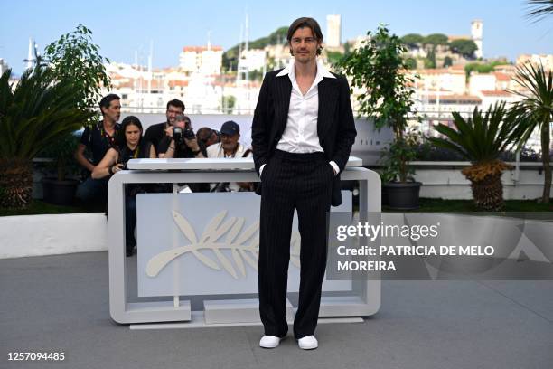 British actor Sam Riley poses during a photocall for the film "Firebrand" at the 76th edition of the Cannes Film Festival in Cannes, southern France,...