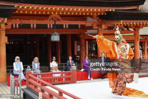 President Joe Biden's granddaughter Maisy Biden and spouses of Group of Seven leaders watch a traditional Bugaku dance performance at Itsukushima...