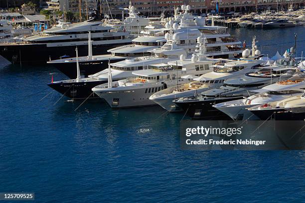 Luxury yachts are moared in the marina at the 2011 Monaco Yacht Show on September 21, 2011 in Monaco, Monaco. The Monaco Yacht Show presents 500...