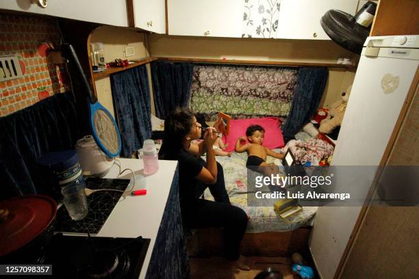 Performer from Circus Estoril puts on makeup before a night of drive-in performance amidst the coronavirus pandemic on July 18, 2020 in Itaguai,...