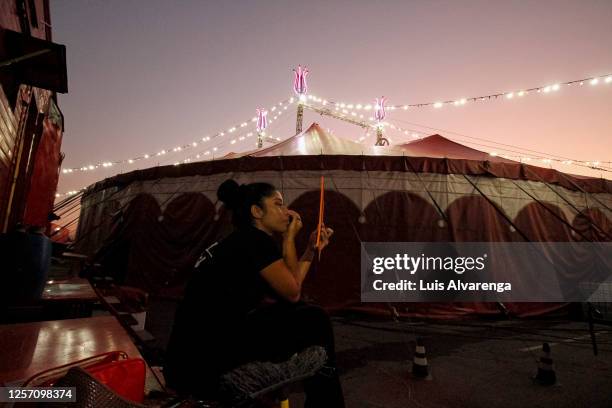 Performer from Circus Estoril puts on makeup before a night of drive-in performance amidst the coronavirus pandemic on July 18, 2020 in Itaguai,...