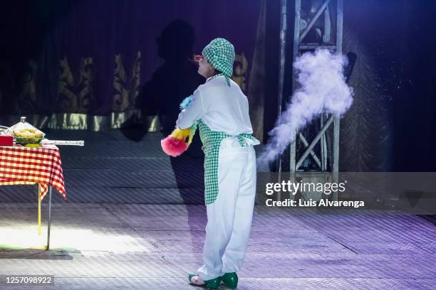 An entertainer performs during a Circus Estoril drive-in performance amidst the coronavirus pandemic on July 18, 2020 in Itaguai, Brazil. After being...