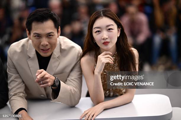Singaporean director Anthony Chen and Chinese actress Zhou Dongyu pose during a photocall for the film "Ran Dong" at the 76th edition of the Cannes...