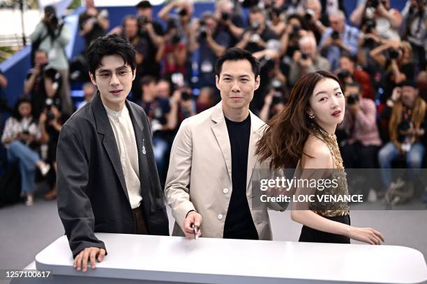 Chinese actor Liu Haoran, Singaporean director Anthony Chen and Chinese actress Zhou Dongyu pose during a photocall for the film "Ran Dong" at the...