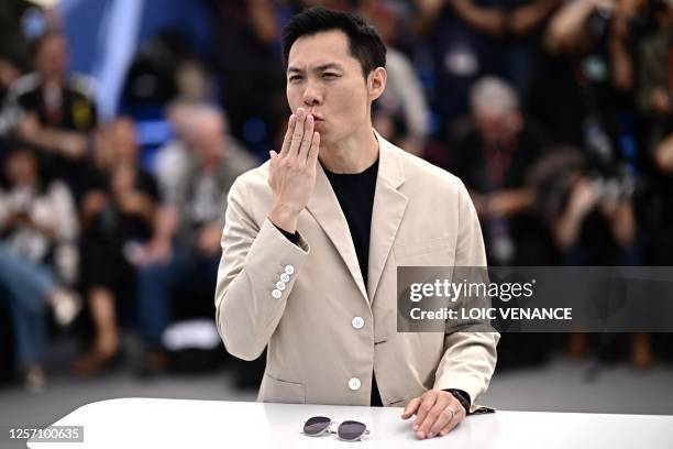 Singaporean director Anthony Chen poses during a photocall for the film "Ran Dong" at the 76th edition of the Cannes Film Festival in Cannes,...