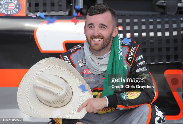 Austin Dillon, driver of the Bass Pro Shops Chevrolet, celebrates in Victory Lane after winning the NASCAR Cup Series O'Reilly Auto Parts 500 at...