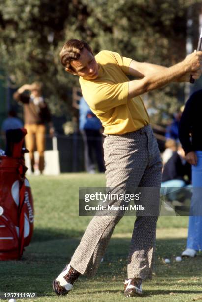 Golfer Bruce Crampton of Australia hits his shot during a golf event circa 1970's.