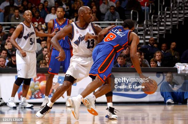Latrell Sprewell of the New York Knicks handles the ball against Michael Jordan of the Washington Wizards at the MCI Center on December 13, 2001 in...