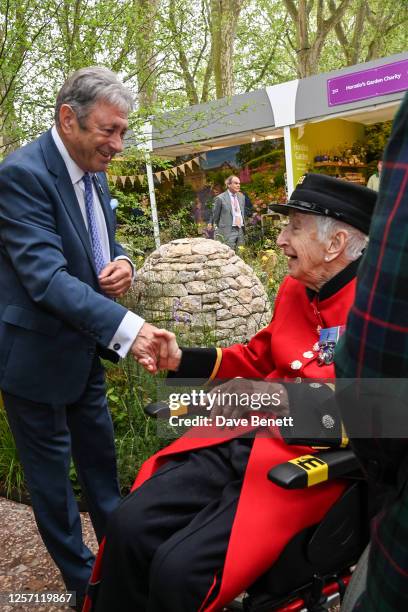 Alan Titchmarsh and guest pose in Horatio's Garden designed by Charlotte Harris and Hugo Bugg at the RHS Chelsea Flower Show 2023 on May 22, 2023 in...