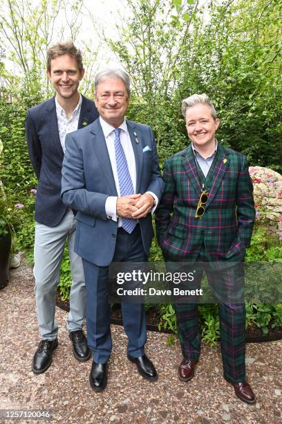 Hugo Bugg, Alan Titchmarsh and Charlotte Harris pose in Horatio's Garden designed by Charlotte Harris and Hugo Bugg at the RHS Chelsea Flower Show...