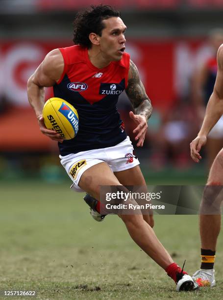 Harley Bennell of the Demons looks upfield during the round 7 AFL match between the Hawthorn Hawks and the Melbourne Demons at GIANTS Stadium on July...