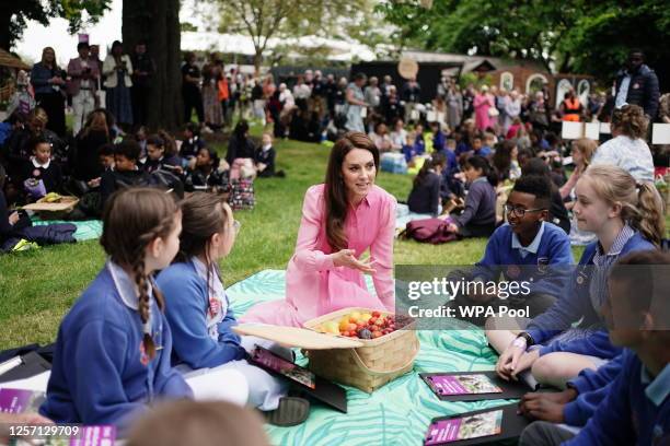 Catherine, Princess of Wales speaks to pupils from schools as she takes part in the first Children's Picnic at the RHS Chelsea Flower Show, at the...