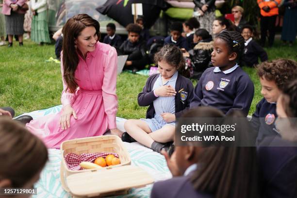 Catherine, Princess of Wales speaks to pupils from schools as she takes part in the first Children's Picnic at the RHS Chelsea Flower Show, at the...