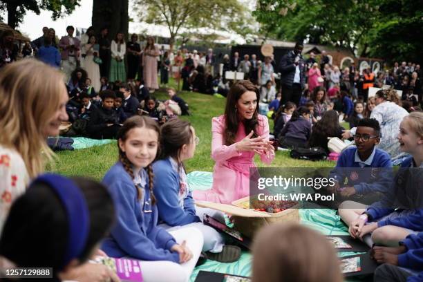 Catherine, Princess of Wales speaks to pupils from schools as she takes part in the first Children's Picnic at the RHS Chelsea Flower Show, at the...