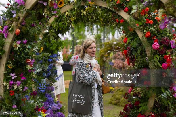 Woman looks at flowers during the press day event for the RHS Chelsea Flower Show 2023 at the grounds of the Royal Hospital Chelsea in London, United...