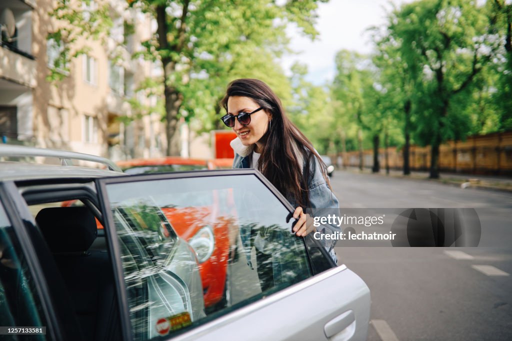 Young woman taking a car share ride on the streets of Berlin