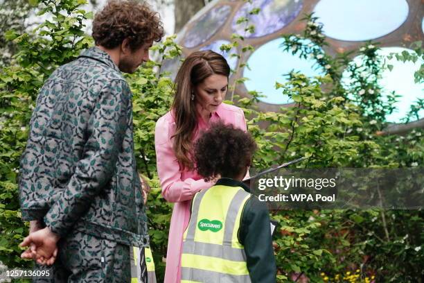 Catherine, Princess of Wales talks with pupils, after taking part in the first Children's Picnic at the RHS Chelsea Flower Show, at the Royal...