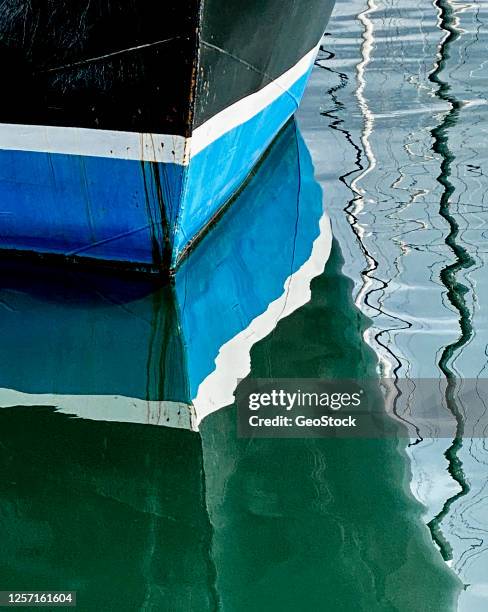 reflection of a moored trawler - bc commercial fishing boats stock pictures, royalty-free photos & images