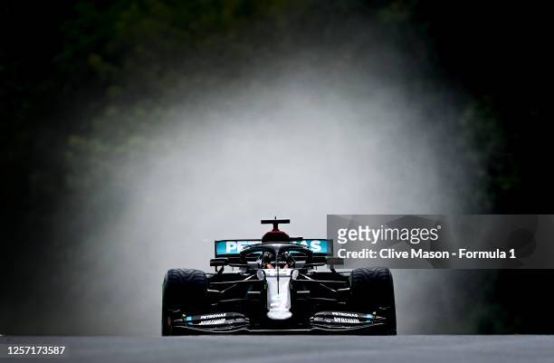 Lewis Hamilton of Great Britain driving the Mercedes AMG Petronas F1 Team Mercedes W11 drives on the way to the grid before the Formula One Grand...