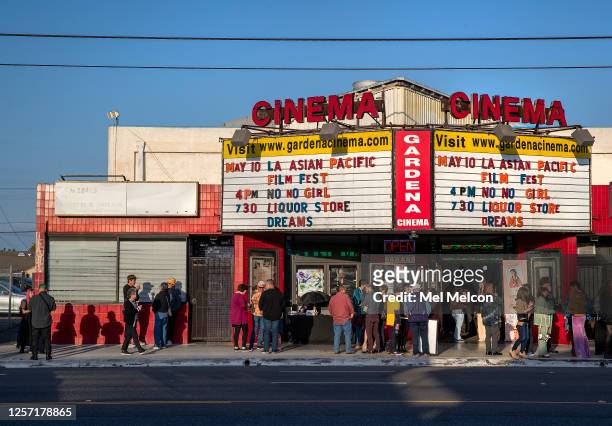 People gather outside the Gardena Cinema in Gardena, before a screening of the movie, "Liquor Store Dreams," part of the Los Angeles Asian Pacific...