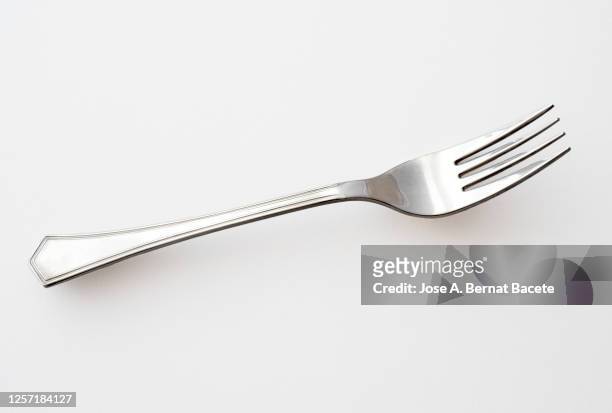 close-up of cutlery,  fork, over white background - vork stockfoto's en -beelden