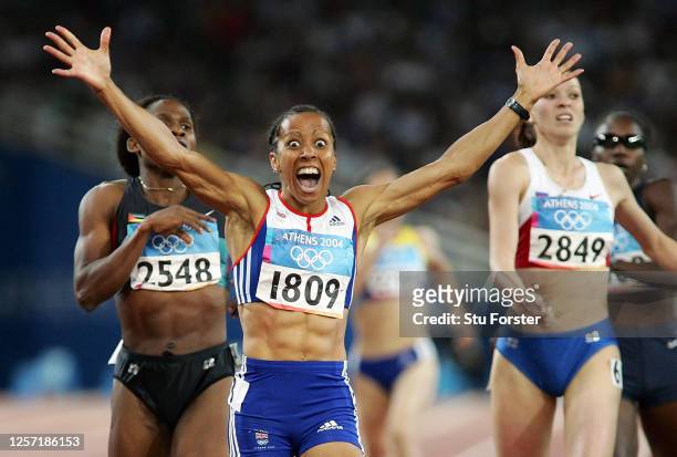 Kelly Holmes of Great Britain celebrates after she wins gold in the women's 800 metre final on August 23, 2004 during the Athens 2004 Summer Olympic...