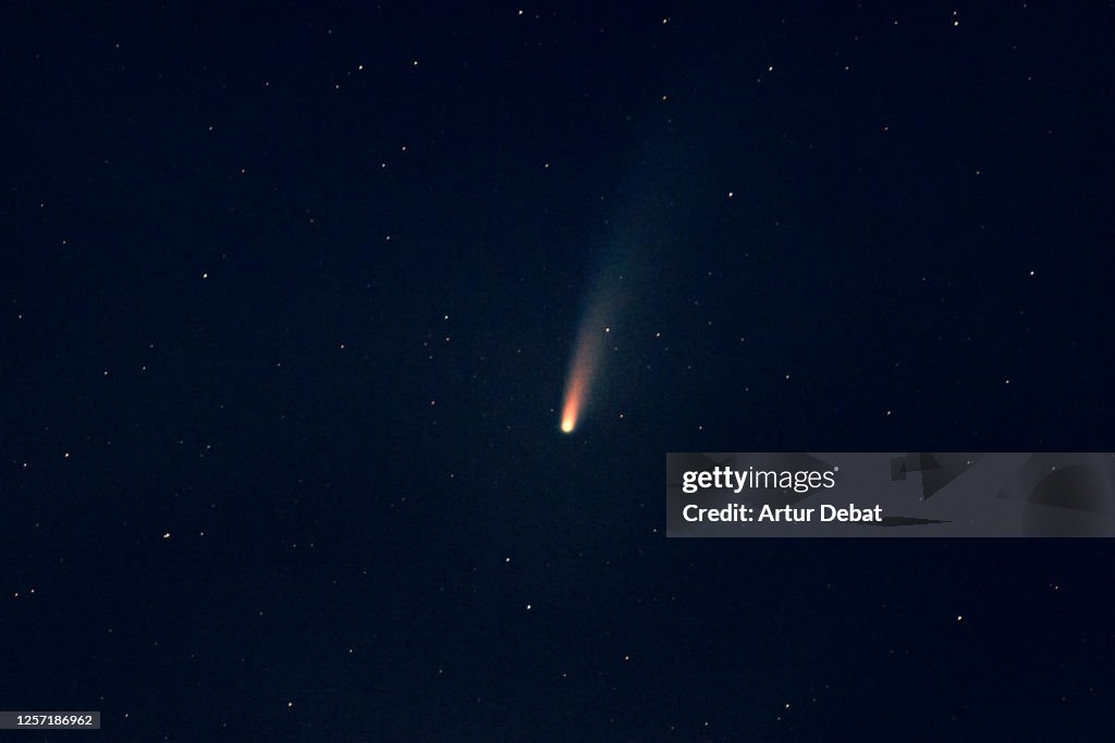 Stargazing the C/2020 F3 NEOWISE comet during night with stars.