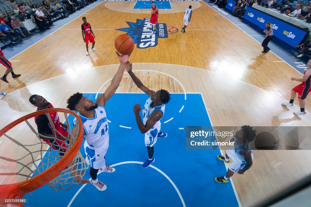 Basketball Players Attempting Slam Dunk High-Res Stock Photo - Getty Images