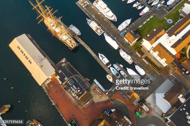 drone aerial view of newport phode island old tradition building with ocean and yatch port with street summer season - jamestown stock pictures, royalty-free photos & images