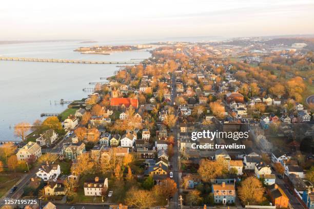 drone aerial view of newport phode island old tradition building with ocean and yatch port with street summer season - anchored stock pictures, royalty-free photos & images