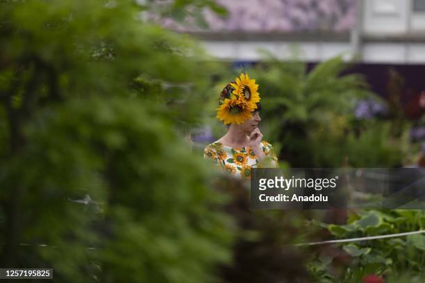 Woman looks on as Catherine, Princess of Wales attends press day event held within the RHS Chelsea Flower Show at the Royal Hospital Chelsea in...