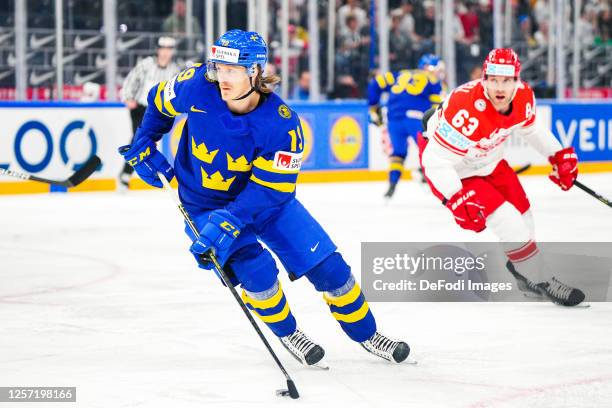 Marcus Sorensen of Sweden controls the ball during the 2023 IIHF Ice Hockey World Championship Finland - Latvia game between Denmark and Sweden at...